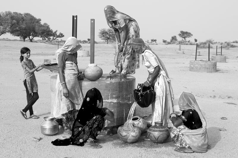 Traditional water supply science and technology of India - 'Sweet' drinking water being collected from a 'kuin' (shallow well) in Thar Desert, Bikaner district, Rajasthan